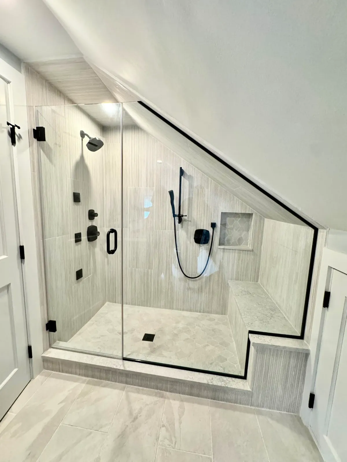 Full-length frameless wall mirror in an entryway